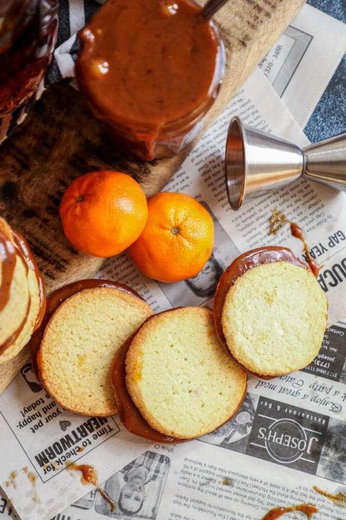 Keto Alfajores cookies on newspaper