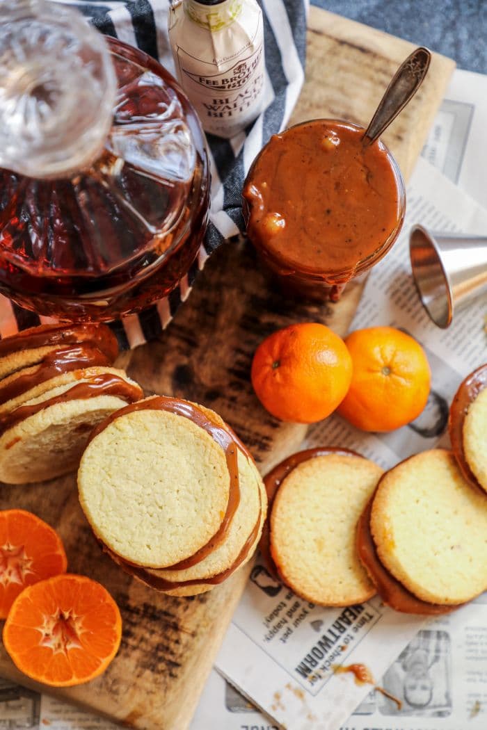 Keto Alfajores cookies on a brown cutting board