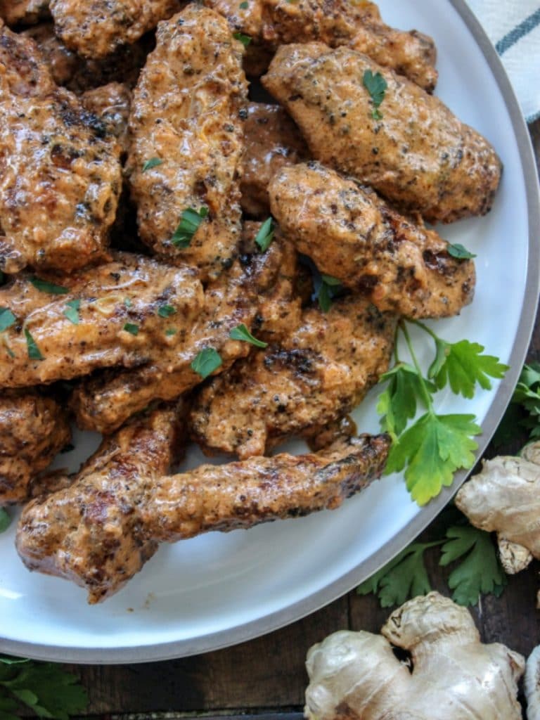 A plate of crispy butter chicken hot wings.