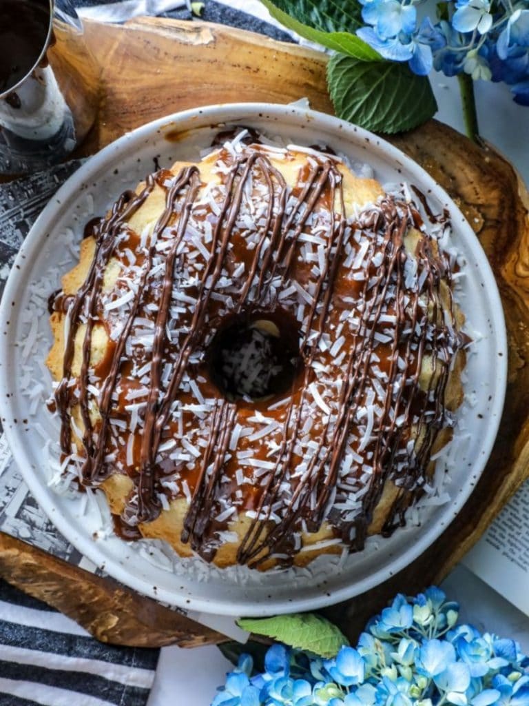 Keto Samoa Bundt Cake on a white plate with blue flowers.