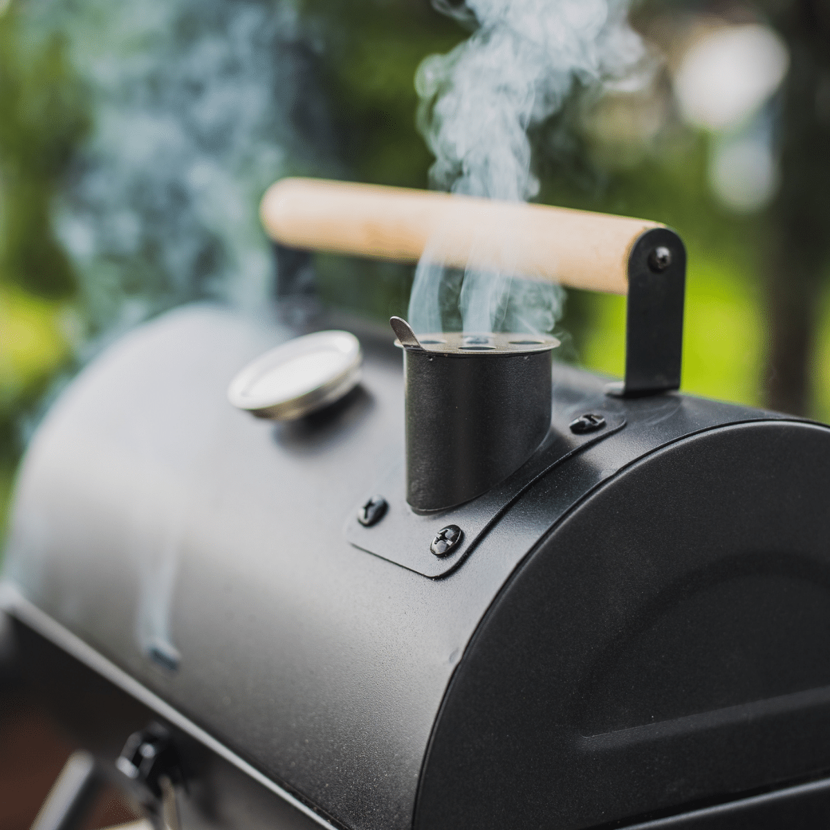 A grill with smoke coming out of it