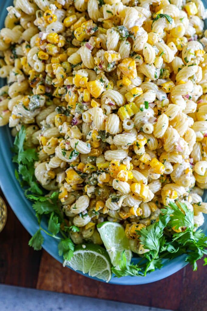 Grilled Elote Pasta Salad Recipe served on a large blue serving platter.