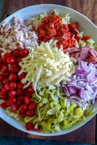 Adding the meat and veggies to the cooked pasta