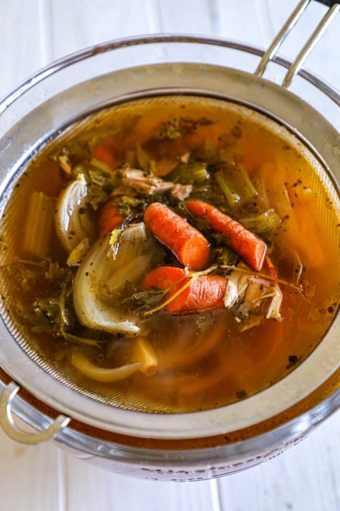 Turkey stock strained in a large bowl